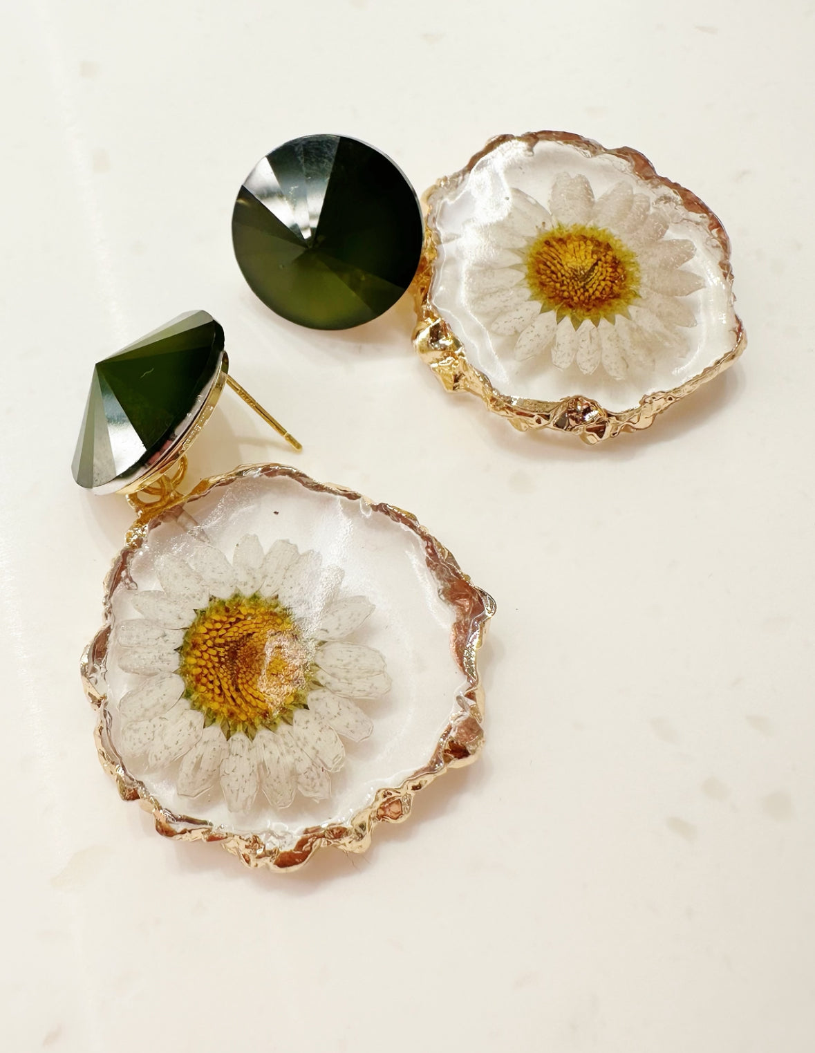 gold rimmed flower earrings