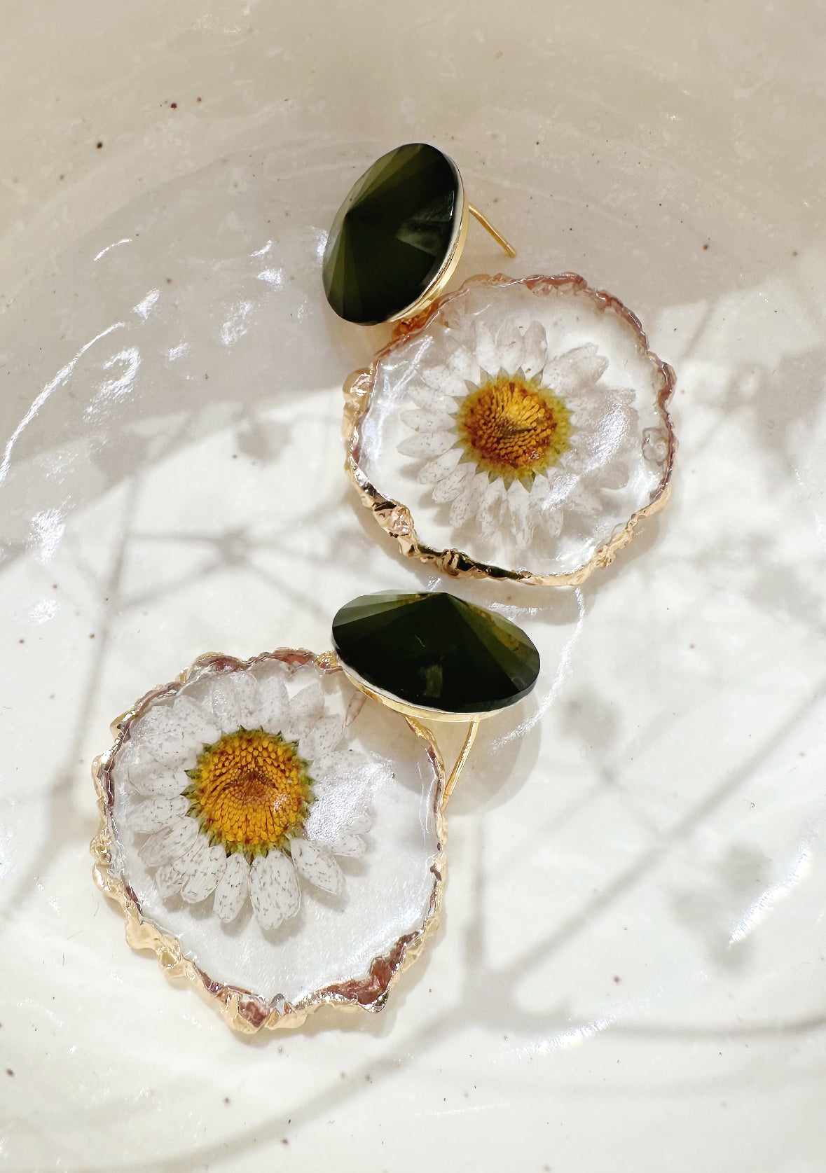 gold rimmed flower earrings