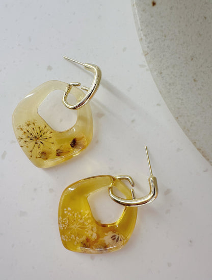 Golden floral hoop earrings